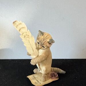 Country Artists Love Story" figurine, a realistic kitten with a  feather